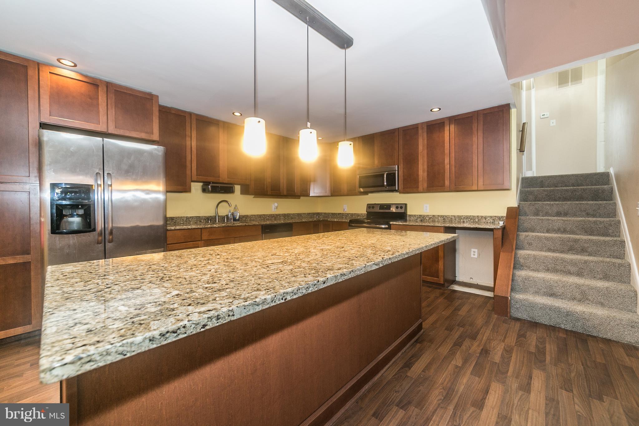 209 Redbud Road Edgewood, MD 21040 - Photo 7 of 30 a large kitchen with kitchen island a counter space a sink appliances and cabinets
