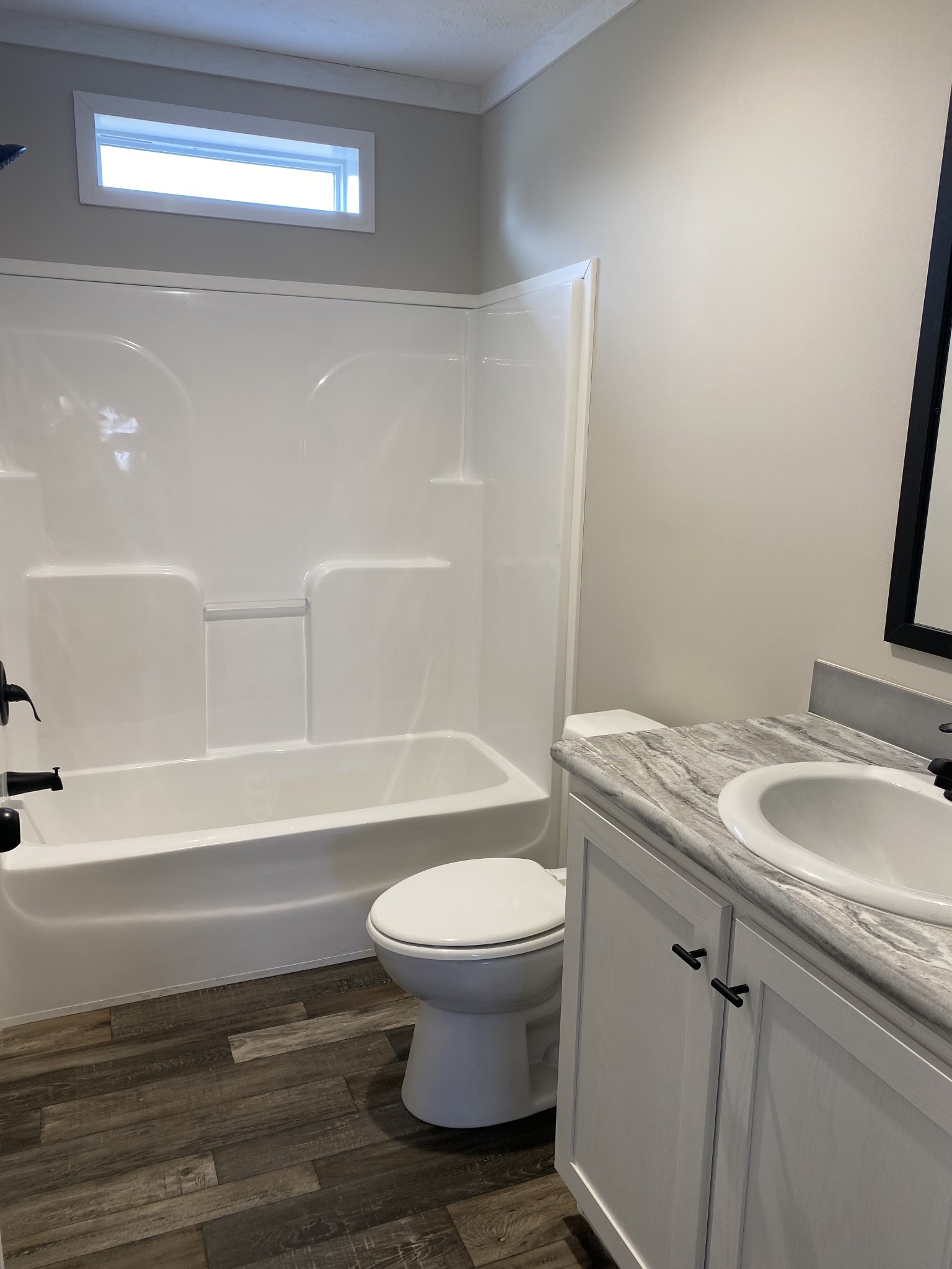 1668 Gamaliel Road Red Boiling Springs, TN 37150 - Photo 16 of 25 a bathroom with a granite countertop toilet and a sink