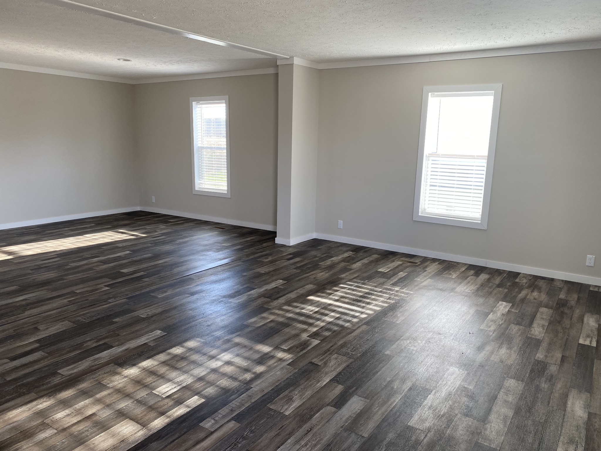 1668 Gamaliel Road Red Boiling Springs, TN 37150 - Photo 4 of 25 a view of an empty room with wooden floor and a window