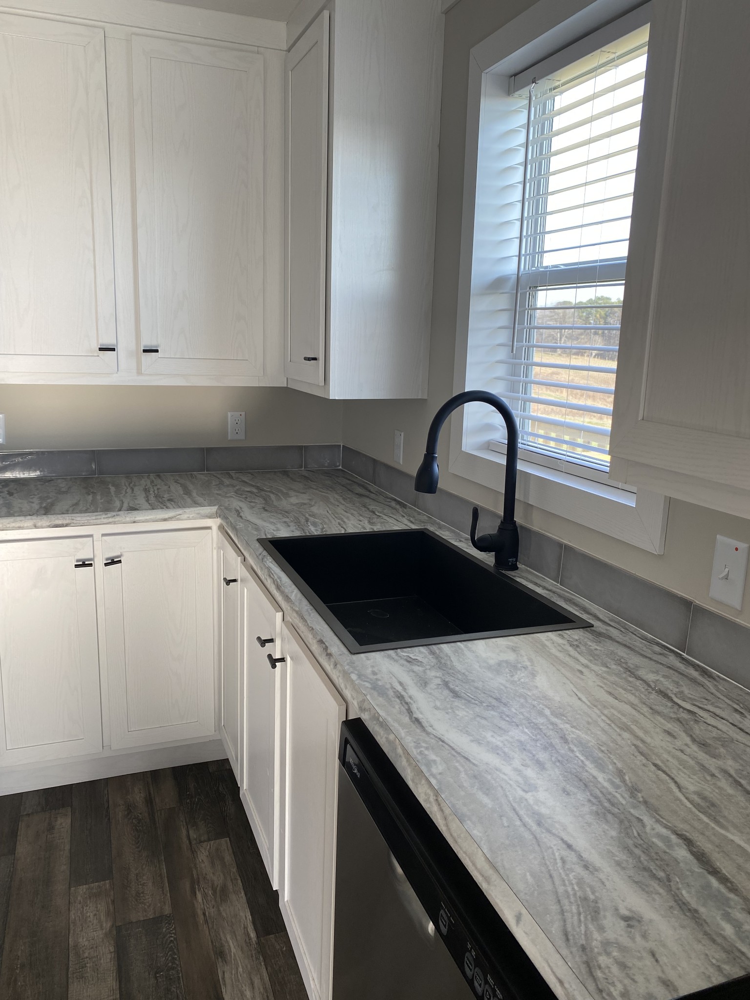 1668 Gamaliel Road Red Boiling Springs, TN 37150 - Photo 9 of 25 a kitchen with granite countertop a sink and a stove