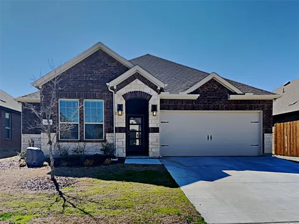 a front view of a house with yard