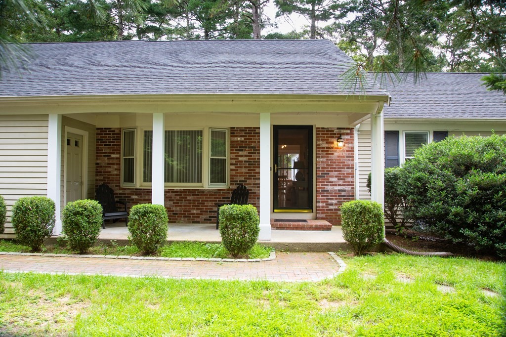 a front view of a house with garden