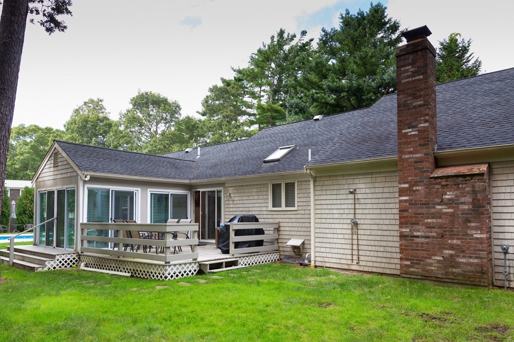 329 White Oak Trail Barnstable, MA 02632 - Photo 11 of 38 a view of a house with a backyard and a patio