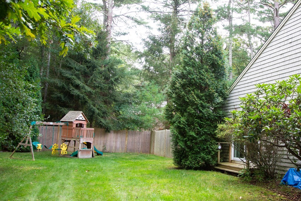 329 White Oak Trail Barnstable, MA 02632 - Photo 14 of 38 a front view of a house with garden