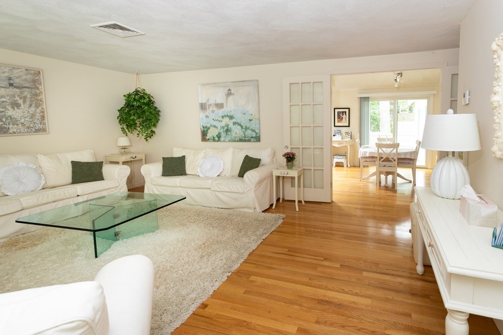 329 White Oak Trail Barnstable, MA 02632 - Photo 15 of 38 a living room with furniture and wooden floor