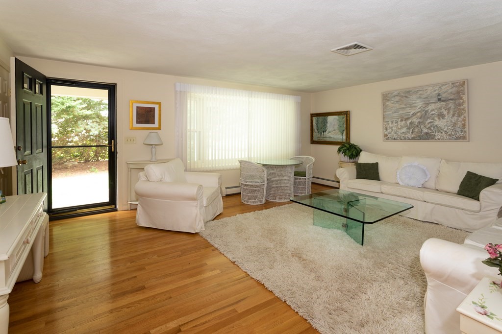 329 White Oak Trail Barnstable, MA 02632 - Photo 17 of 38 a living room with furniture and a large window