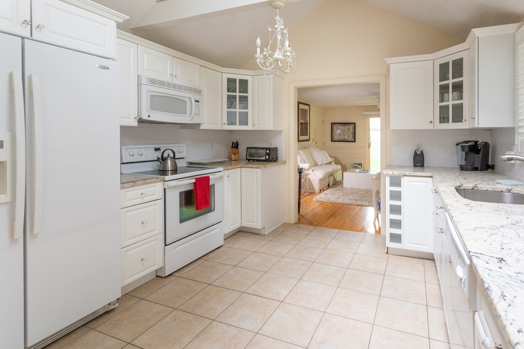 329 White Oak Trail Barnstable, MA 02632 - Photo 22 of 38 a kitchen with cabinets and window