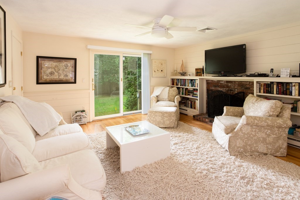 329 White Oak Trail Barnstable, MA 02632 - Photo 23 of 38 a living room with furniture and a flat screen tv