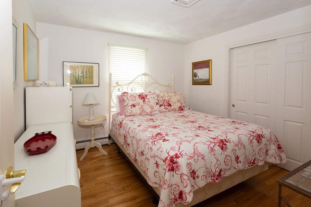 329 White Oak Trail Barnstable, MA 02632 - Photo 25 of 38 a bedroom with a bed and a table in it