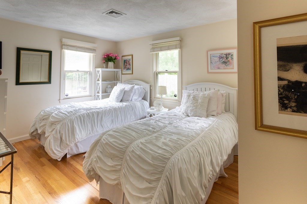 329 White Oak Trail Barnstable, MA 02632 - Photo 26 of 38 a bedroom with two beds and a large window