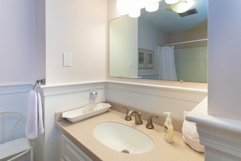 329 White Oak Trail Barnstable, MA 02632 - Photo 30 of 38 a bathroom with a sink and a mirror