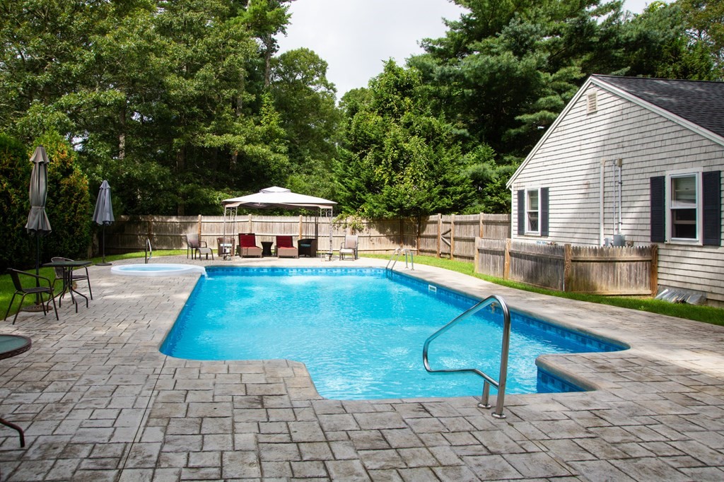 329 White Oak Trail Barnstable, MA 02632 - Photo 4 of 38 a house view with a swimming pool and sitting space