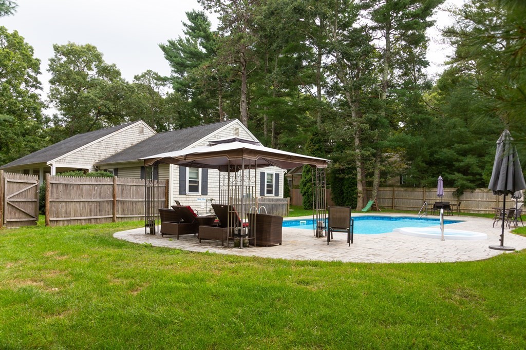 329 White Oak Trail Barnstable, MA 02632 - Photo 5 of 38 a view of a house with a yard porch and sitting area