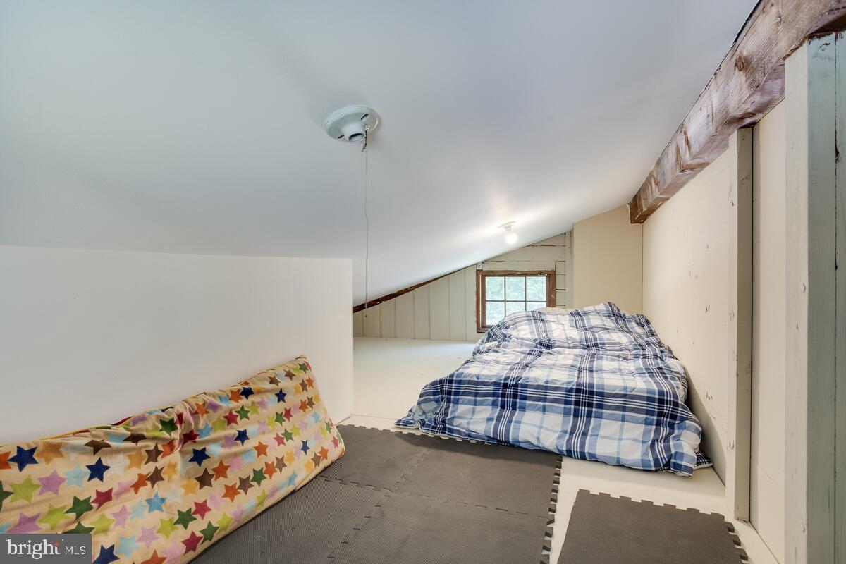 2144 Cedar Road Port Republic, MD 20676 - Photo 35 of 56 a bedroom with bed and a window