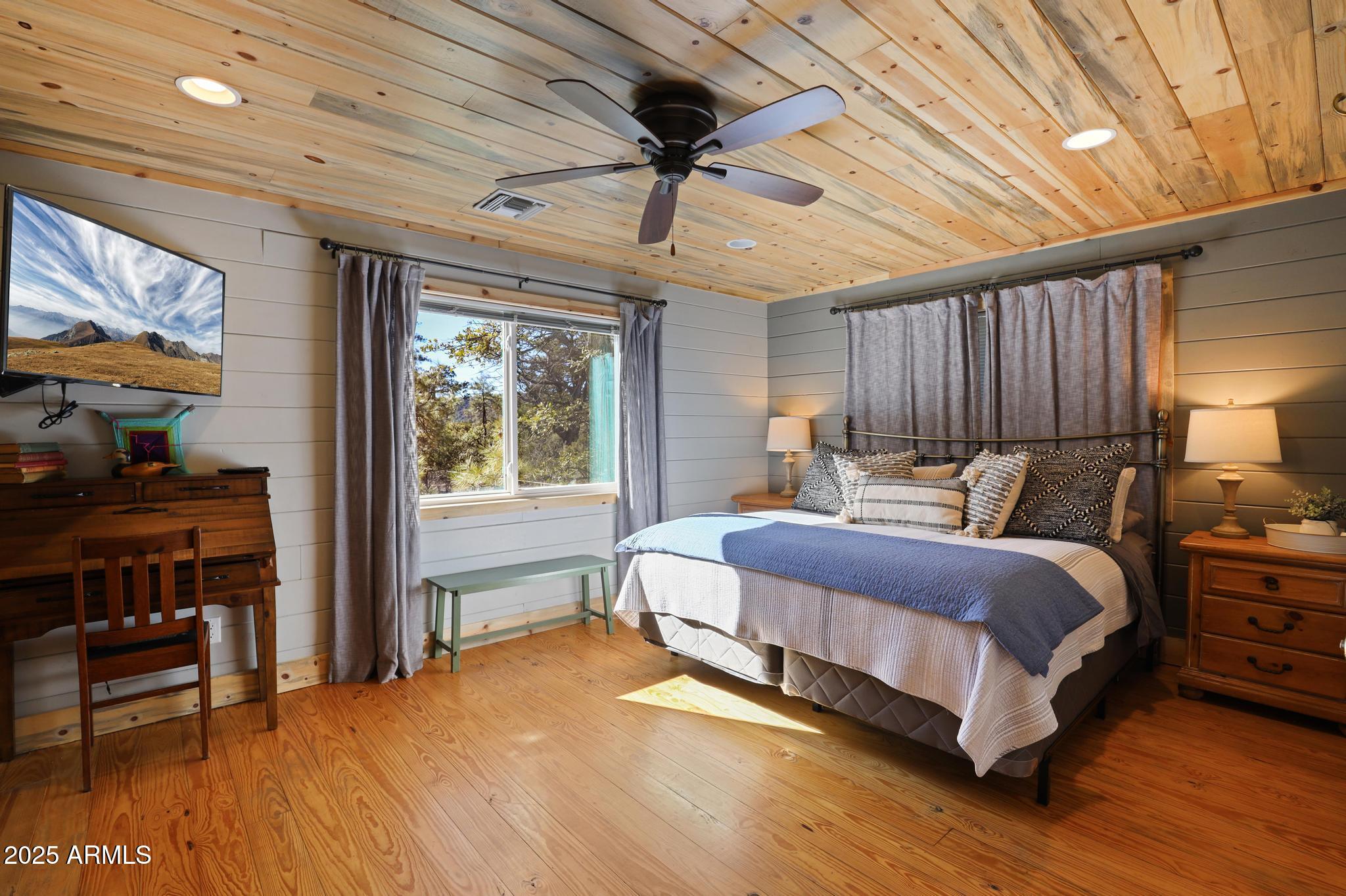 4744 Charles Circle Strawberry, AZ 85544 - Photo 14 of 39 a spacious bedroom with a bed and a table in it