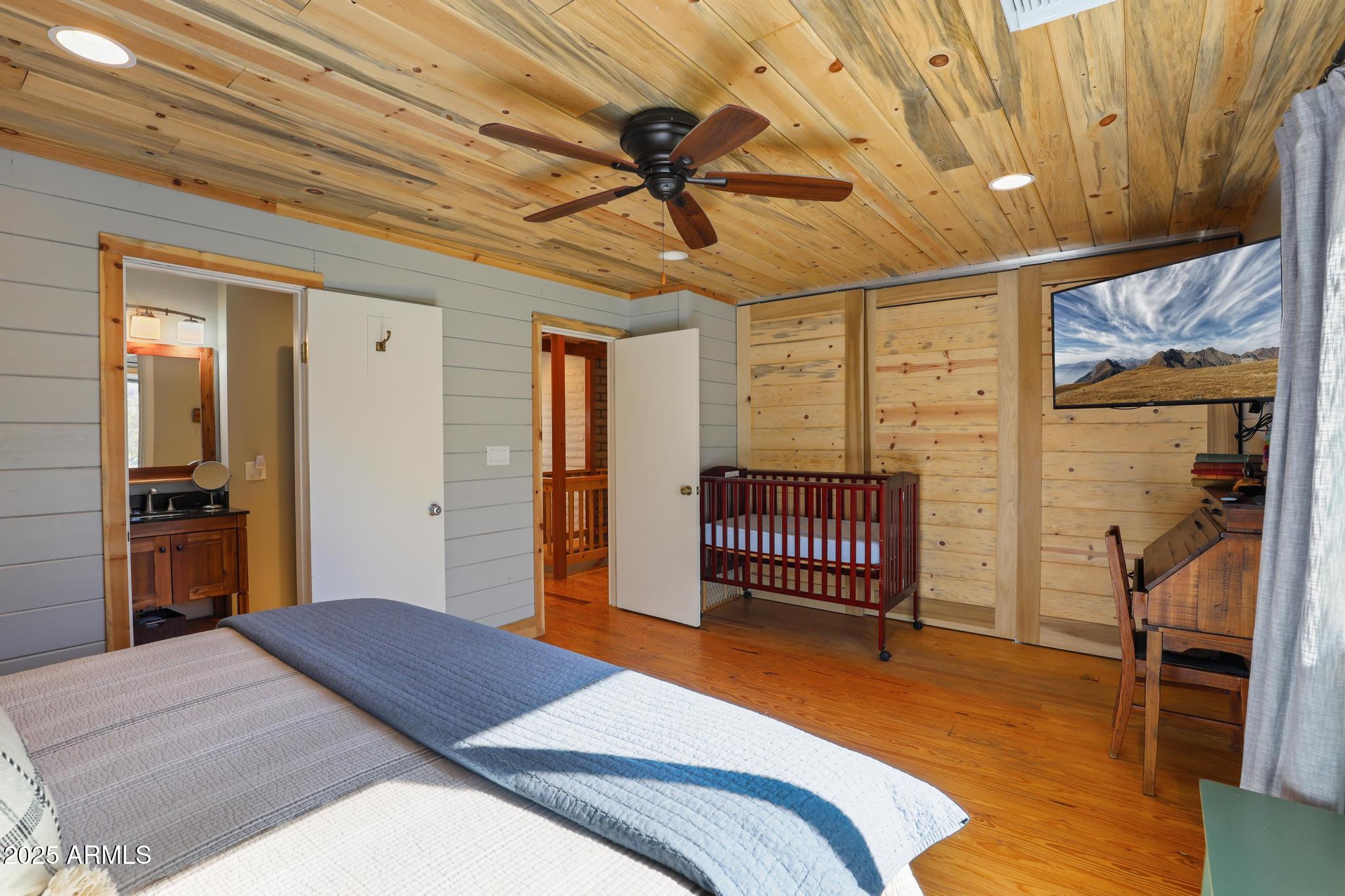 4744 Charles Circle Strawberry, AZ 85544 - Photo 15 of 39 a bedroom with a bed and a walk in closet
