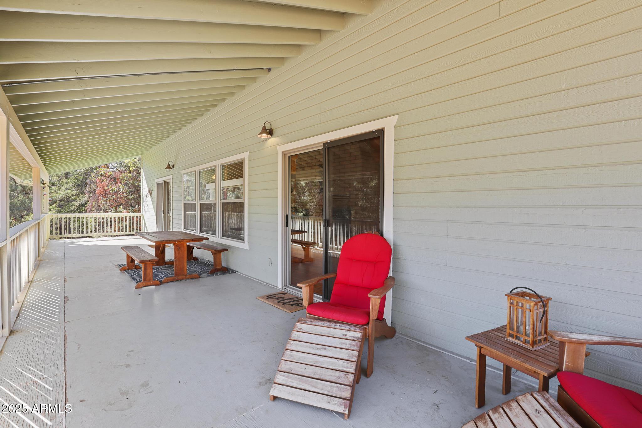 4744 Charles Circle Strawberry, AZ 85544 - Photo 17 of 39 a backyard of a house with barbeque oven table and chairs