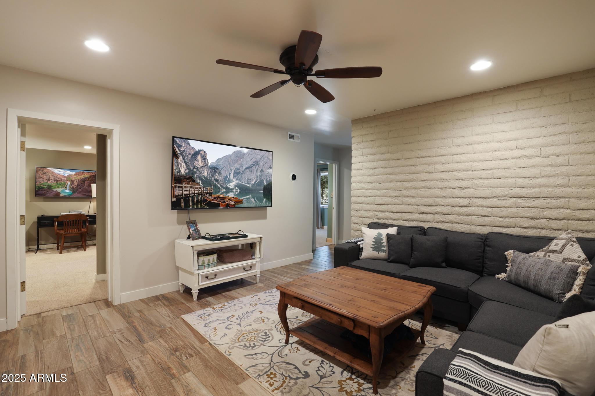 4744 Charles Circle Strawberry, AZ 85544 - Photo 19 of 39 a living room with furniture and a flat screen tv
