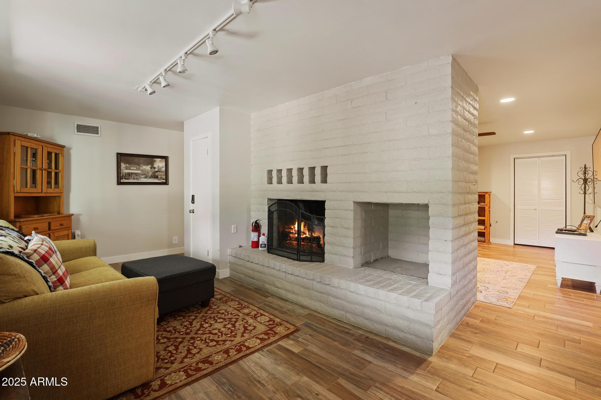 4744 Charles Circle Strawberry, AZ 85544 - Photo 23 of 39 a living room with furniture and a fireplace