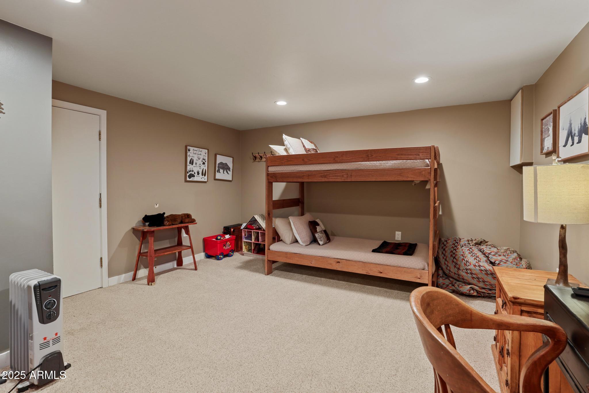4744 Charles Circle Strawberry, AZ 85544 - Photo 31 of 39 a bedroom with furniture and a large window