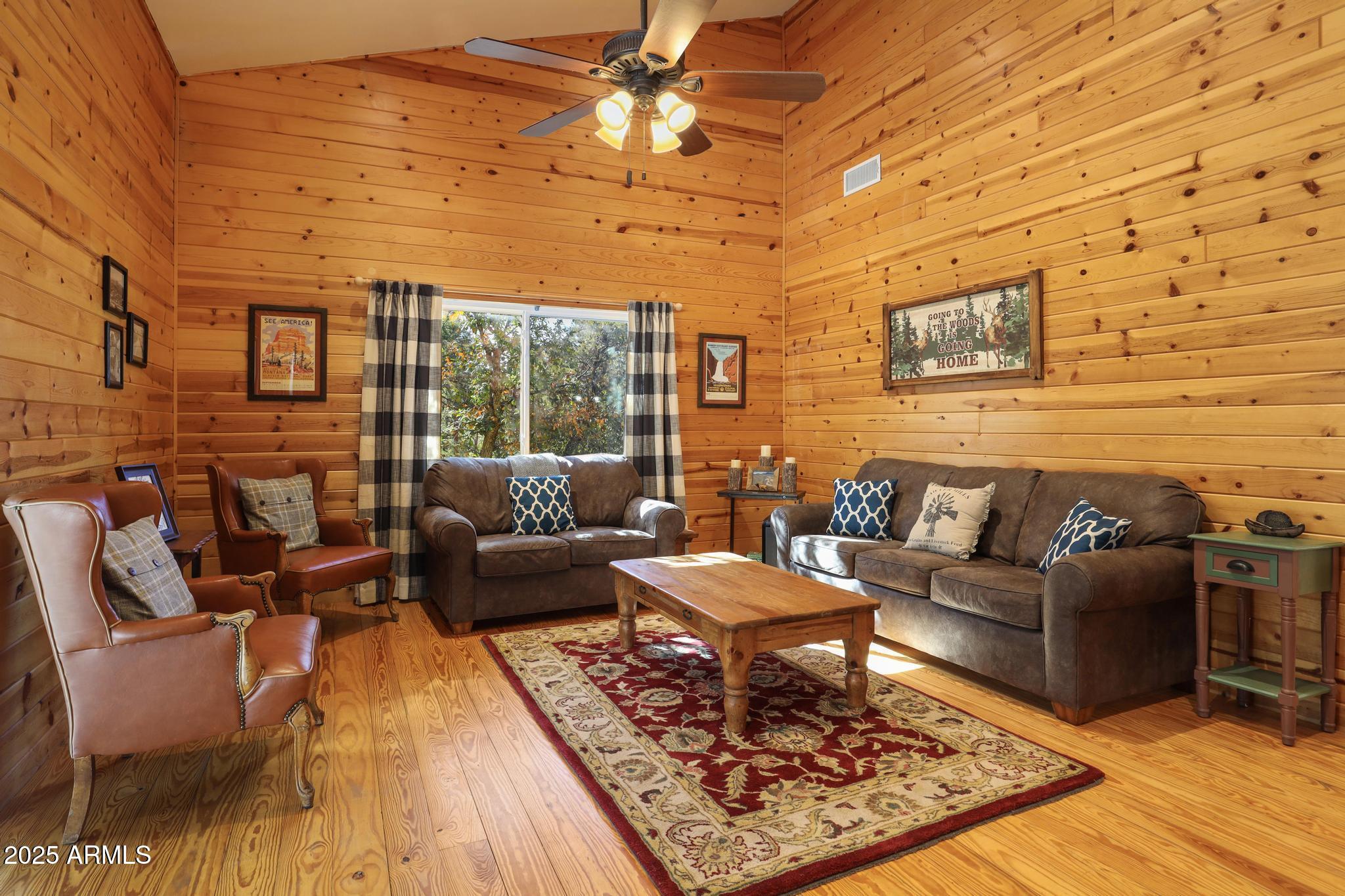 4744 Charles Circle Strawberry, AZ 85544 - Photo 6 of 39 a living room with furniture and a rug