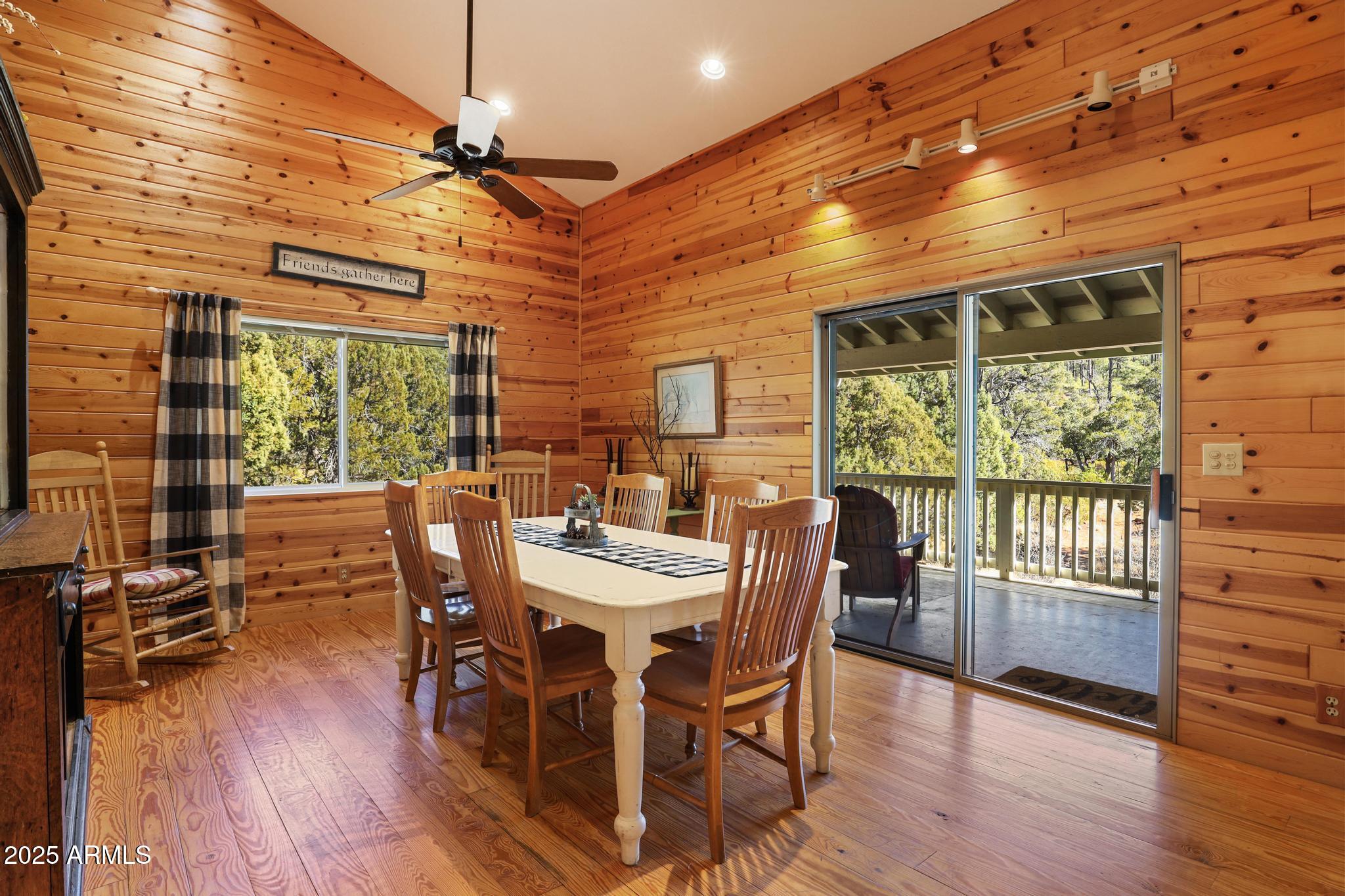 4744 Charles Circle Strawberry, AZ 85544 - Photo 8 of 39 a view of a dining room with furniture window and wooden floor