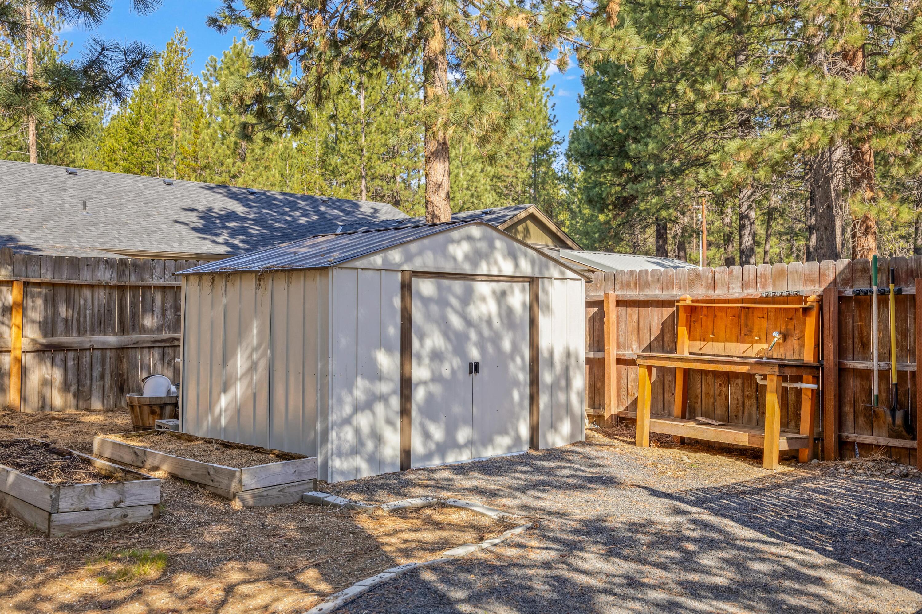 16983 Jacinto Road Bend, OR 97707 - Photo 24 of 29 a backyard of a house with wooden fence