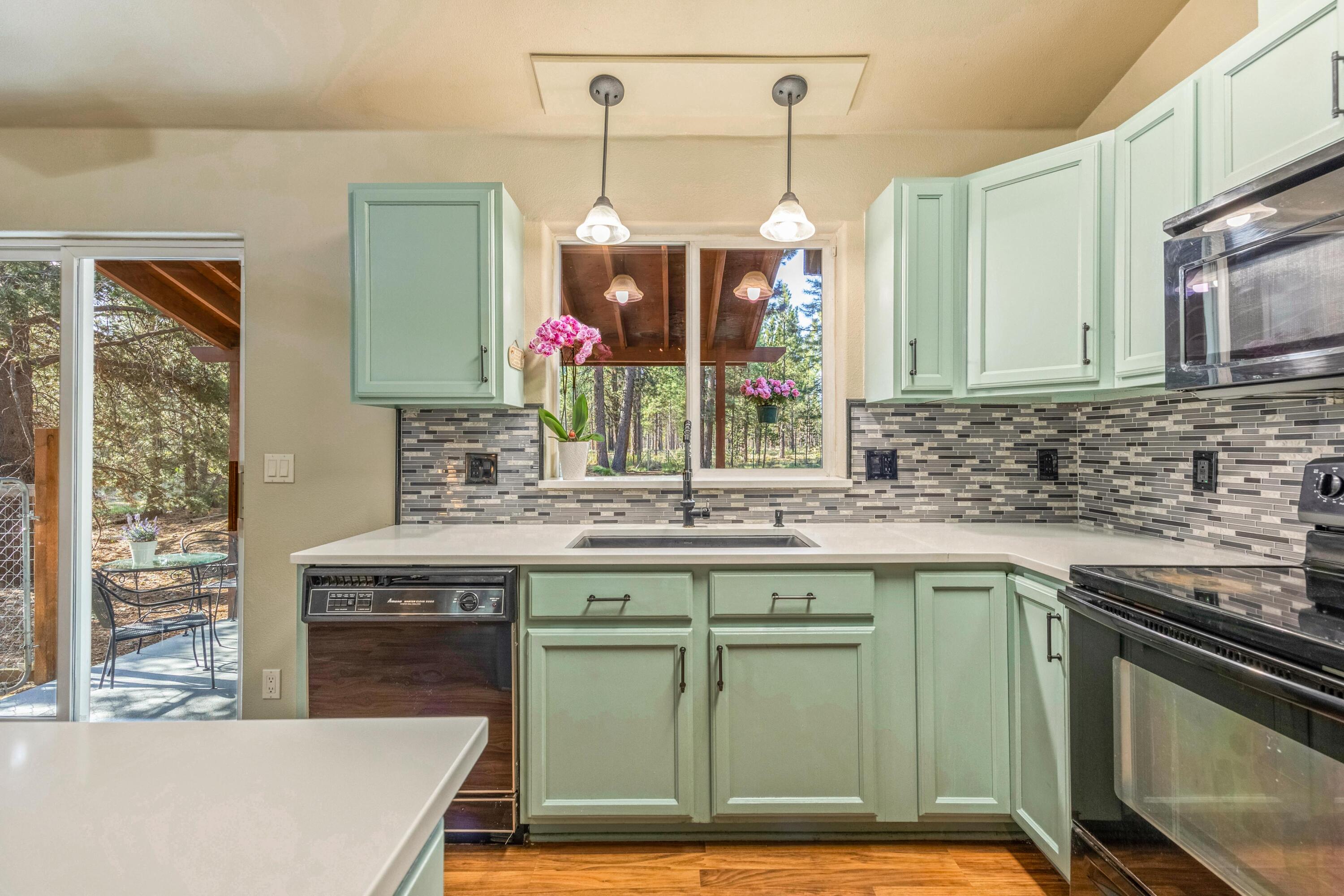 16983 Jacinto Road Bend, OR 97707 - Photo 8 of 29 a kitchen with a sink and a stove