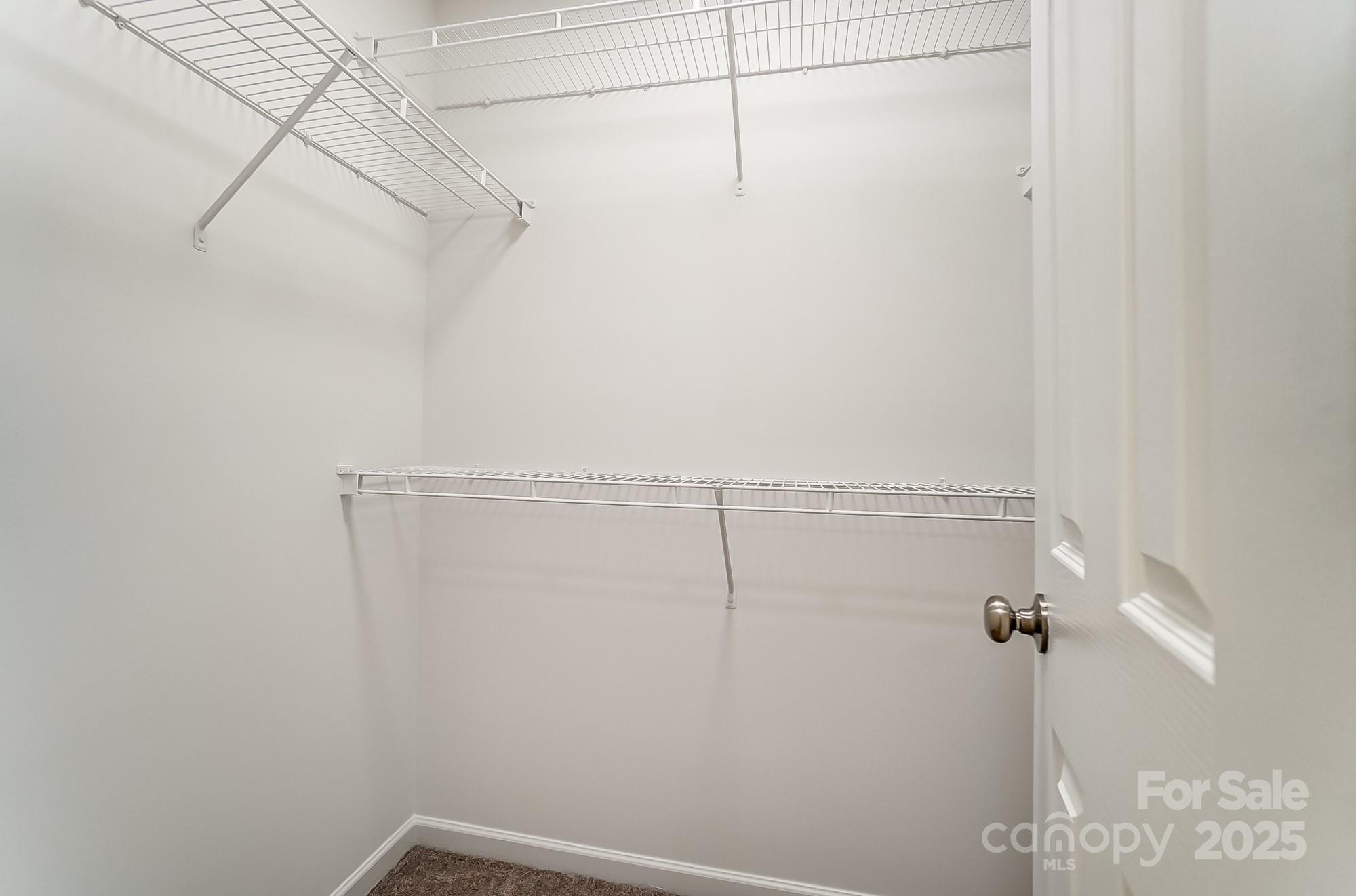 16729 Timber Crossing Road Charlotte, NC 28213 - Photo 23 of 48 a view of a room with racks on the wall