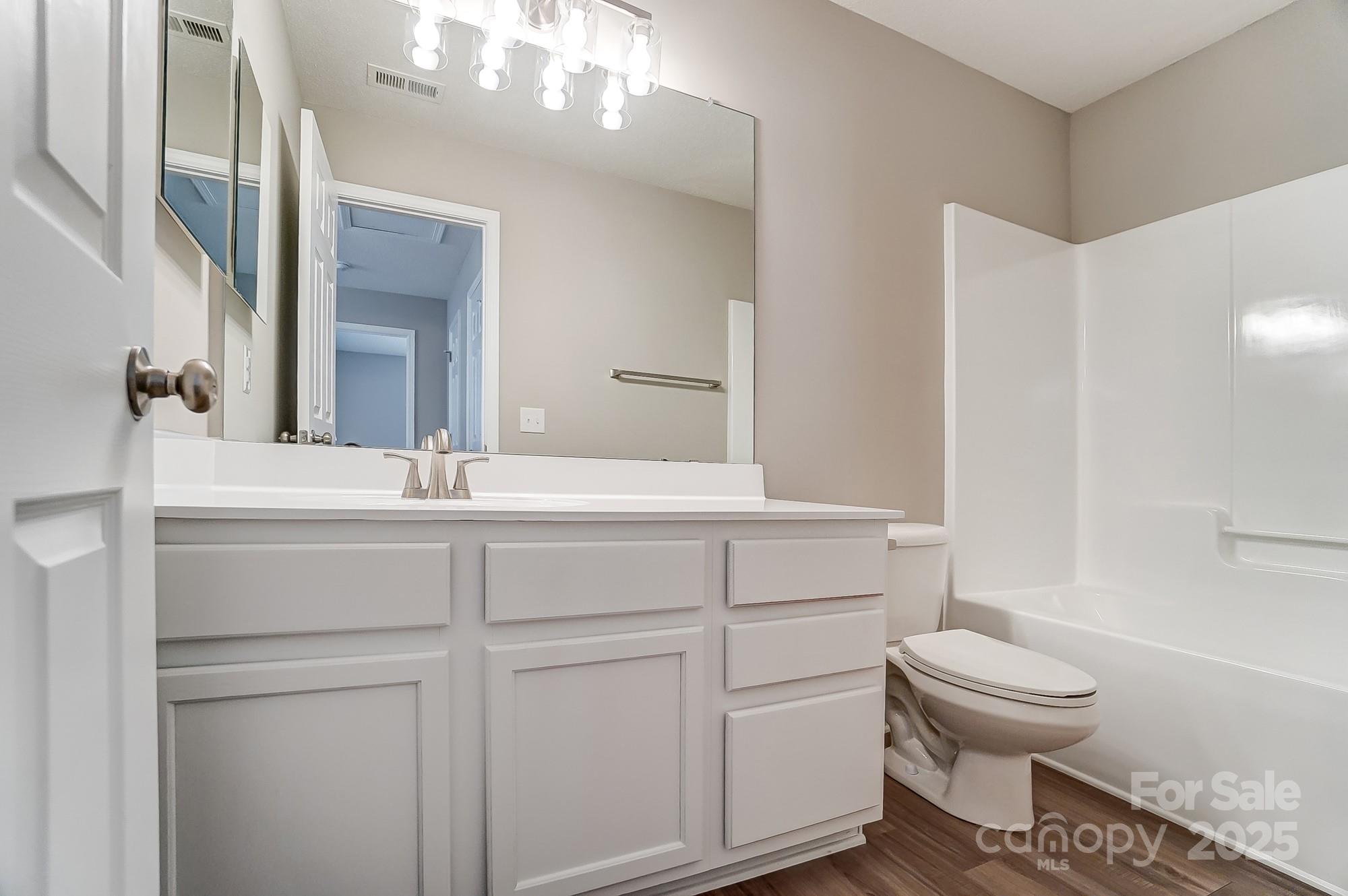 16729 Timber Crossing Road Charlotte, NC 28213 - Photo 38 of 48 a bathroom with a sink toilet and a mirror