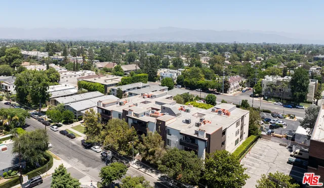 an aerial view of a city with lots of residential buildings