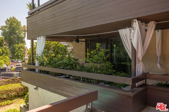 a view of a two chairs in the balcony