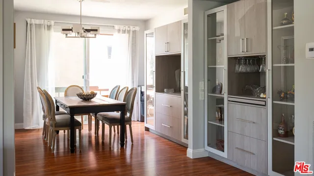 a view of a dining room with furniture window and wooden floor