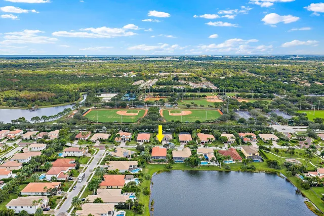 a bedroom with a bed couch and a window