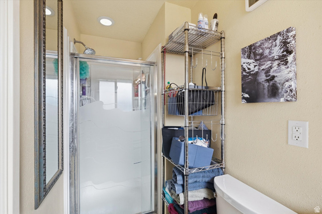 1095 Park Avenue Logan, UT 84321 - Photo 13 of 27 Another view of 3/4 primary bathroom with a stall shower and a textured wall