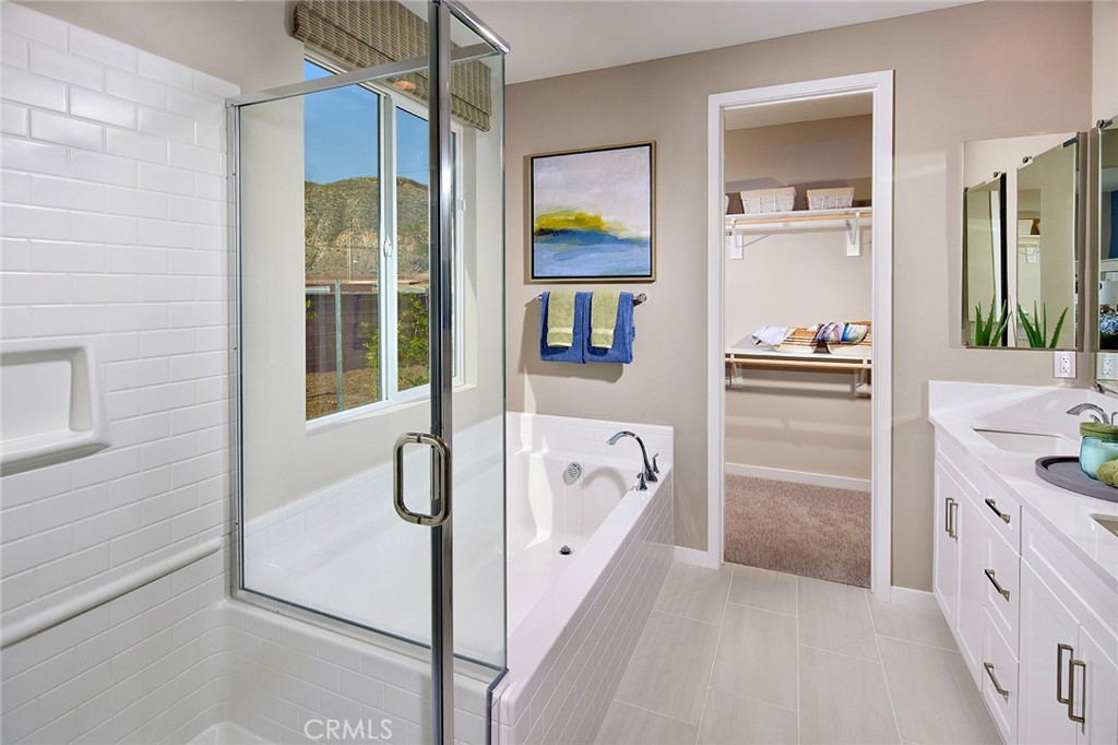 30934 Campania Road Highland, CA 92346 - Photo 11 of 19 a bathroom with a tub sink and mirror