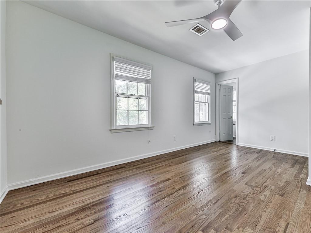 633 Butterworth Road Canton, GA 30114 - Photo 33 of 55 an empty room with wooden floor and windows
