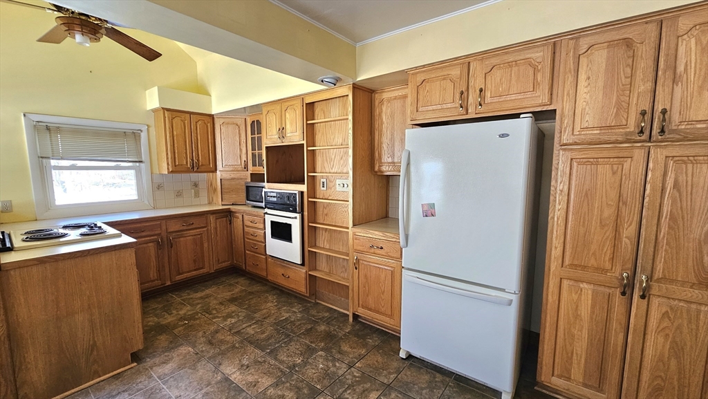 59 North Hatfield Road Hatfield, MA 01038 - Photo 2 of 22 a kitchen with stainless steel appliances a refrigerator and a stove top oven