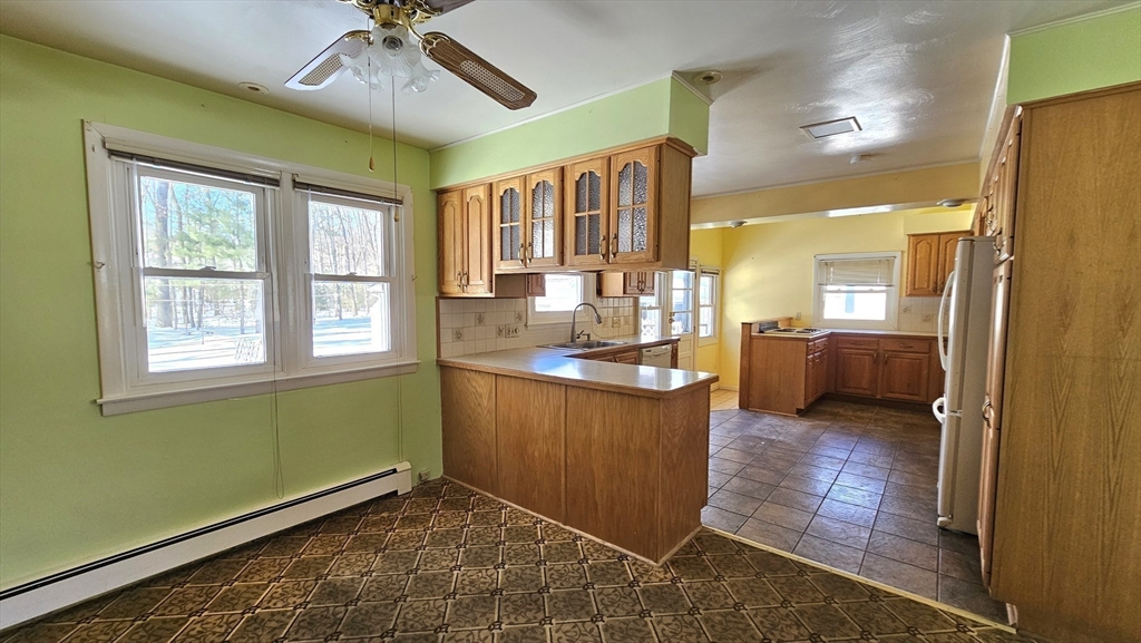 59 North Hatfield Road Hatfield, MA 01038 - Photo 5 of 22 a view of a hallway with wooden floor and a kitchen