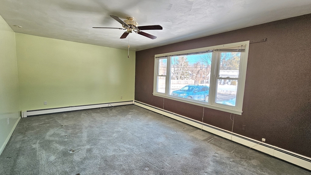 59 North Hatfield Road Hatfield, MA 01038 - Photo 6 of 22 an empty room with windows and fan