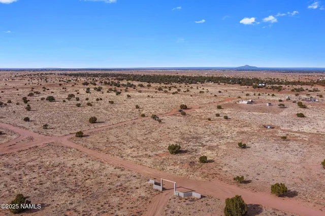 a view of an ocean beach and a yard