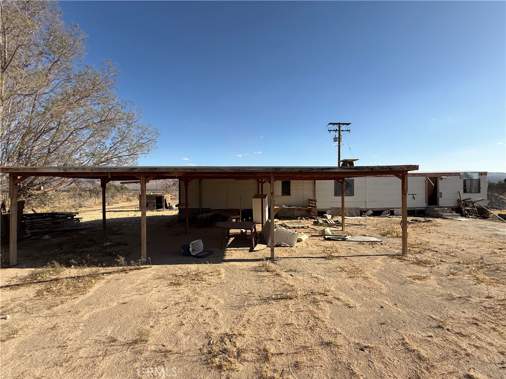 41854 Silver Valley Road Newberry Springs, CA 92365 - Photo 10 of 18 a view of a backyard of a house