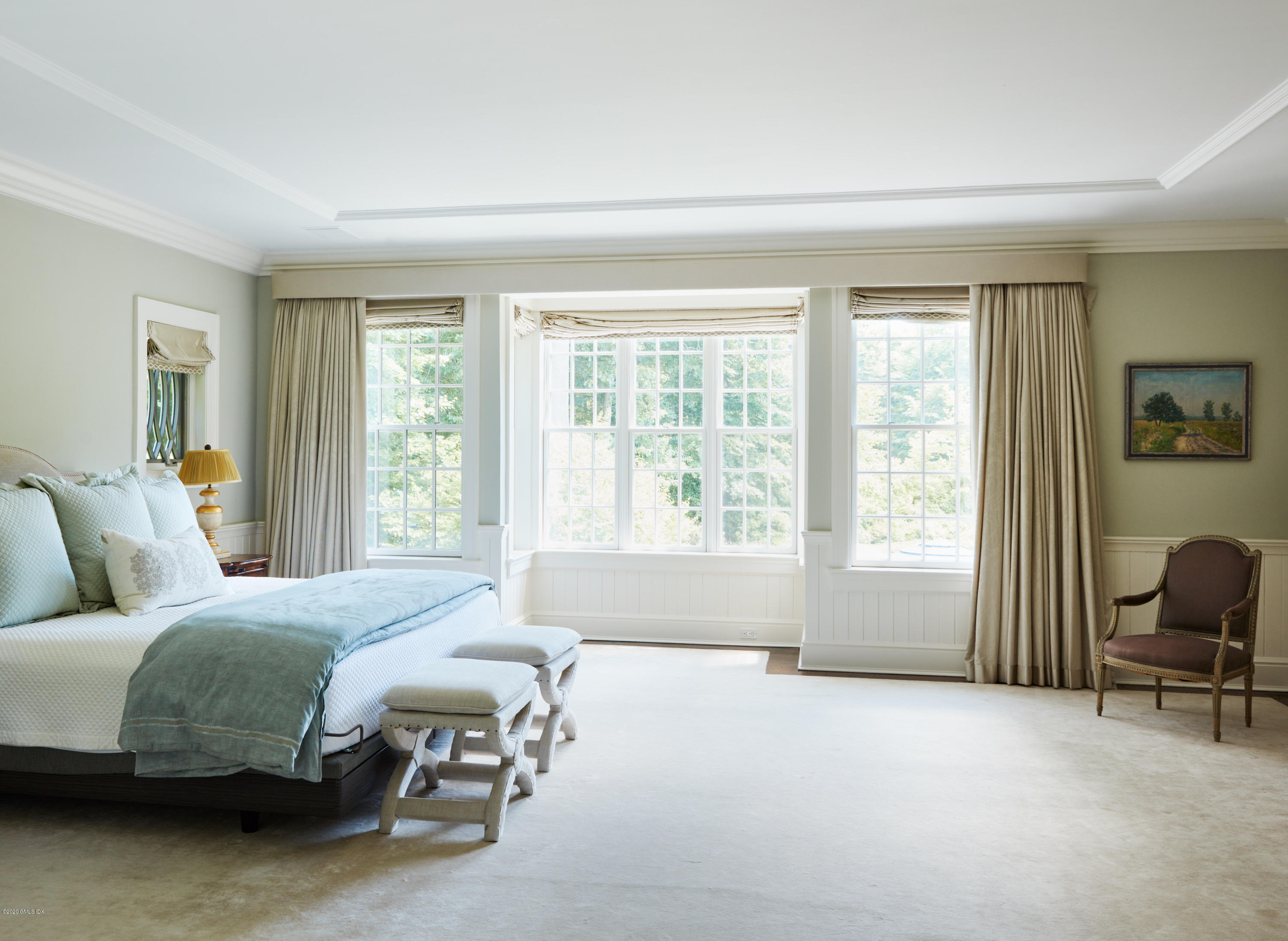 74 Upper Cross Road Greenwich, CT 06831 - Photo 12 of 20 a bedroom with a bed and a large window