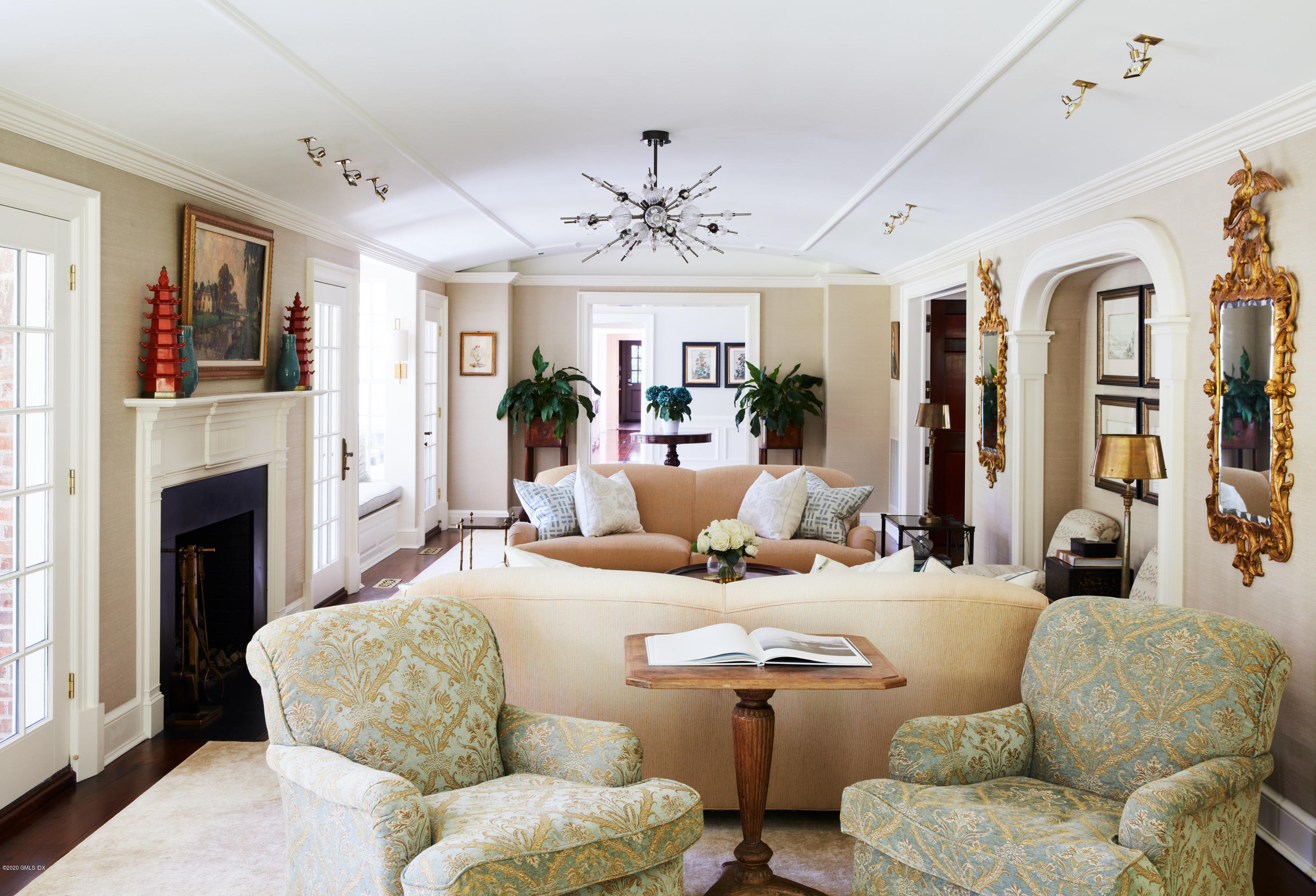 74 Upper Cross Road Greenwich, CT 06831 - Photo 6 of 20 a living room with furniture fireplace and flat screen tv