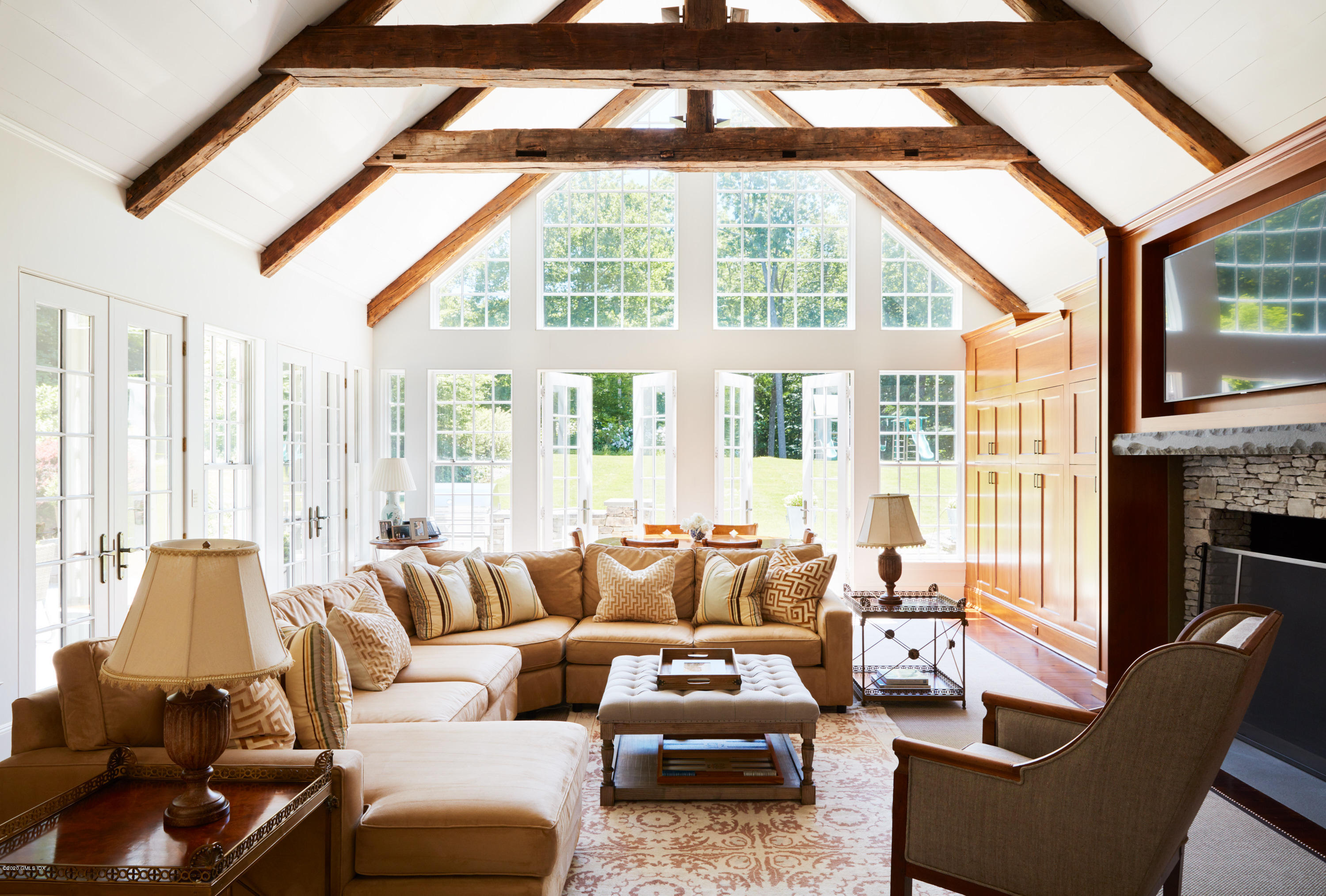 74 Upper Cross Road Greenwich, CT 06831 - Photo 10 of 20 a living room with furniture and large windows