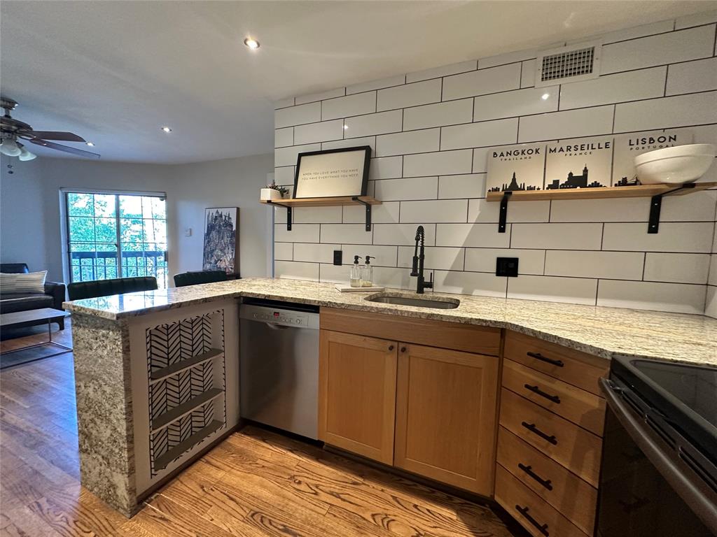 18333 Roehampton Drive, Unit 1524 Dallas, TX 75252 - Photo 1 of 21 a kitchen with a sink and cabinets