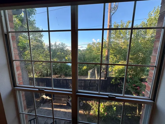 a view of outdoor space with a large window