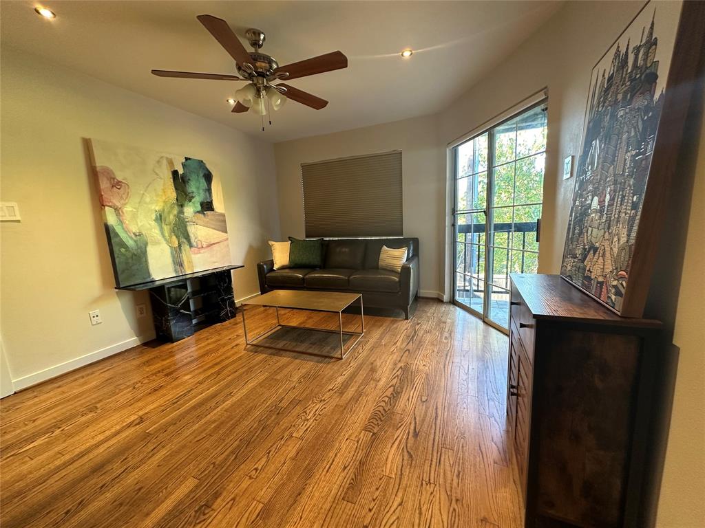 18333 Roehampton Drive, Unit 1524 Dallas, TX 75252 - Photo 17 of 21 a living room with furniture and a wooden floor