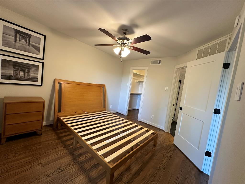 18333 Roehampton Drive, Unit 1524 Dallas, TX 75252 - Photo 19 of 21 a bedroom with a bed and a window