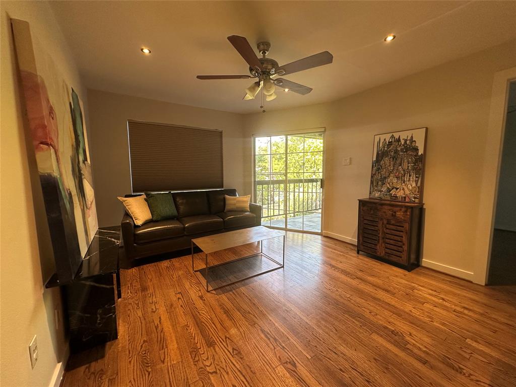 18333 Roehampton Drive, Unit 1524 Dallas, TX 75252 - Photo 9 of 21 a living room with furniture window and wooden floor